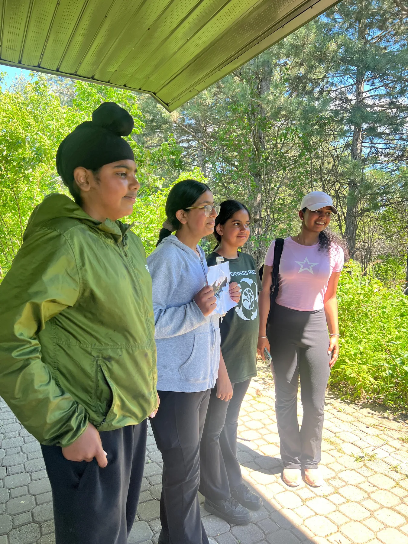 Progress Peel students standing together near trees during a hike