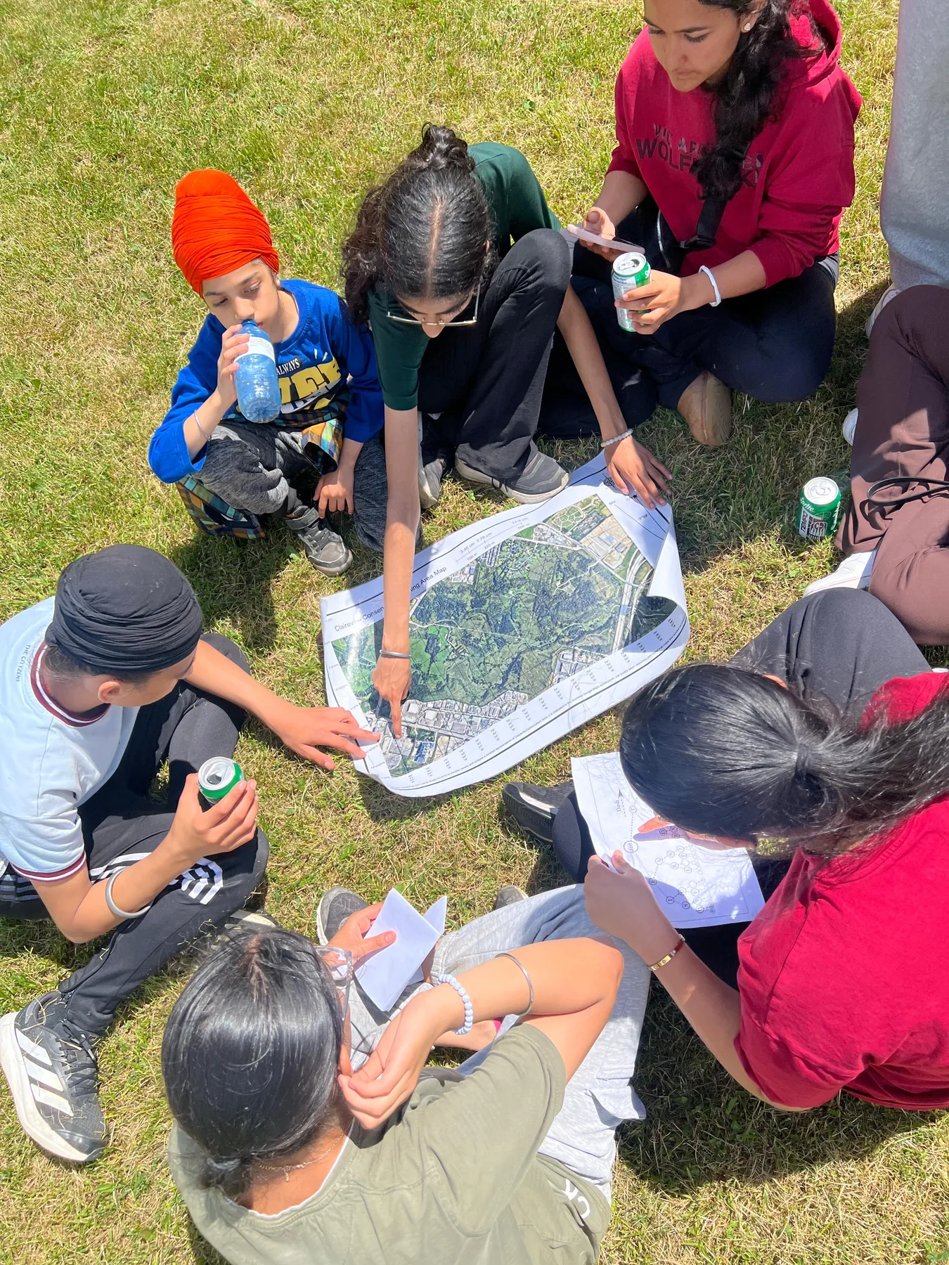 Progress Peel students working together with a map during outdoor training